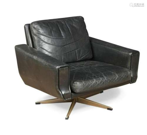 A mid-20th century black leather swivel lounge chair,