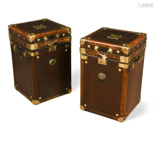 A pair of modern brass-bound leather trunks or