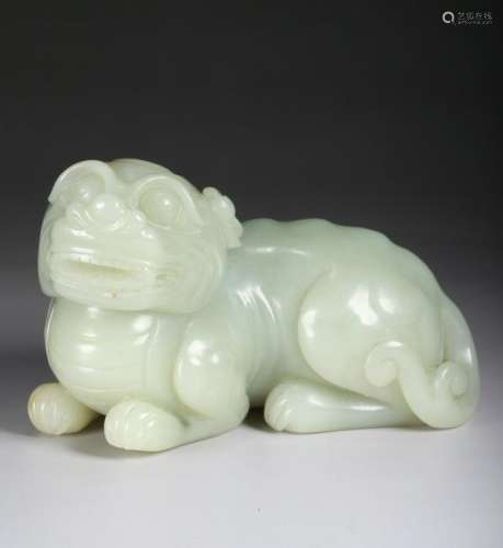 A CHINESE PALE CELADON JADE CARVING OF A MYTHICAL BEAST