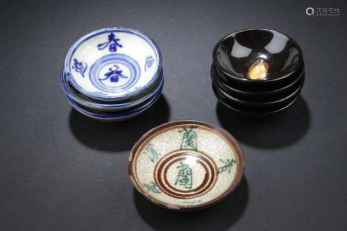 A Group of Eight Porcelain Saucers