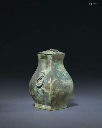 A CHINESE ARCHAIC BRONZE VASES AND COVER (FANGHU)