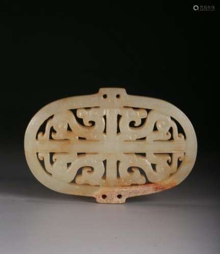 A CELADON AND RUSSET JADE PENDANT