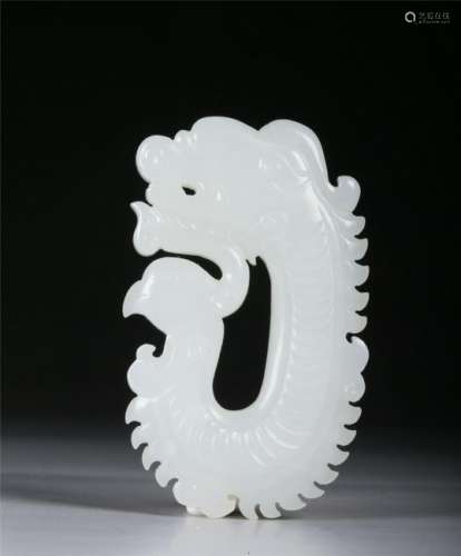 A CARVED JADE DRAGON-FORM PENDANT
