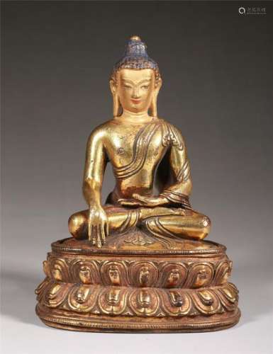 A GILT-BRONZE FIGURE OF SHAKYAMUNI BUDDHA