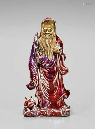 19TH CENTURY FLAMBE GLAZED FIGURE OF AN IMMORTAL