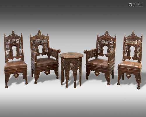 Four Syrian mother of pearl inlaid wooden chairs and a table