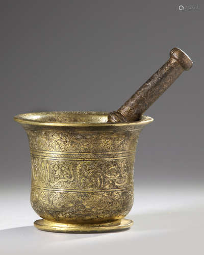 A Mamluk bronze pestle and mortar