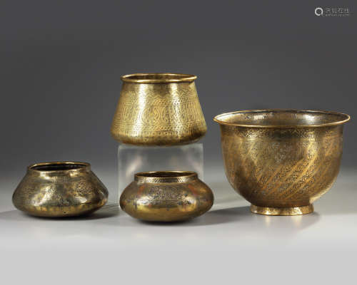 Four Islamic brass bowls