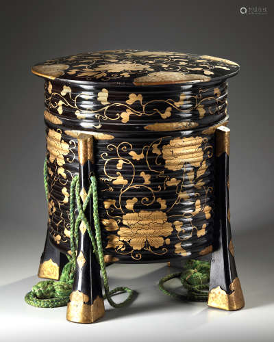 A Japanese black lacquered Hokai-box with gilded fittings.