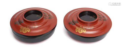 A Japanese set of two black lacquerware round containers with a lid