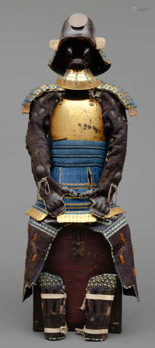 A Japanese gilded suit-of-armour (yoroi) with indigo cords (kon’ito kin’urushinuri nimaidō gusoku).