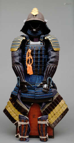 A Japanese black lacquered suit-of-armour (yoroi) with dark blue cords (tetsu kuro’urushinuri mogami nimaidô gusoku)