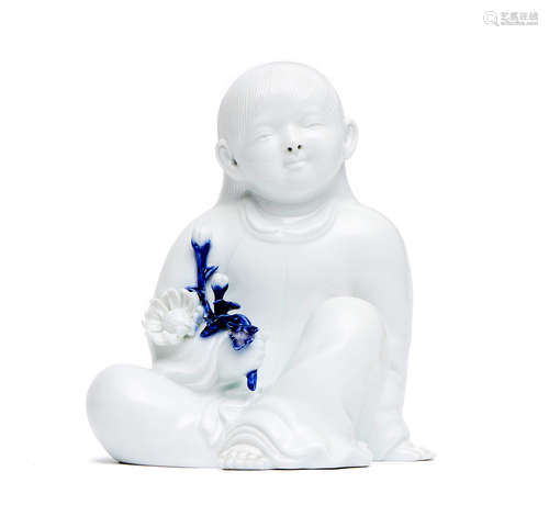 A Japanese white glazed porcelain figure of a child by Sakaida Kakiemon XII (1878–1963)