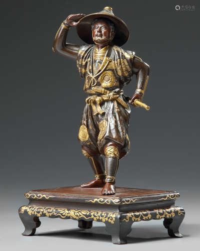 A Japanese parcel gilt bronze figure of a Samurai