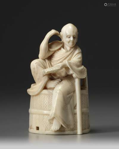 A Japanese ivory okimono of a man seated man