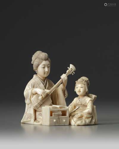 A Japanese ivory okimono of a lady and girl making music