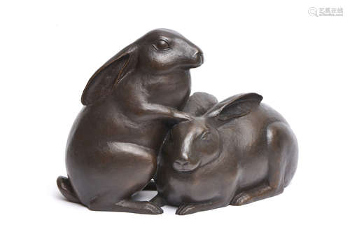 A large Japanese bronze figure of two rabbits