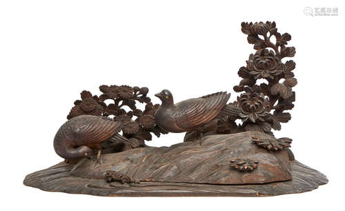 A large Japanese wooden okimono in the shape of a landscape with doves and chrysanthemums