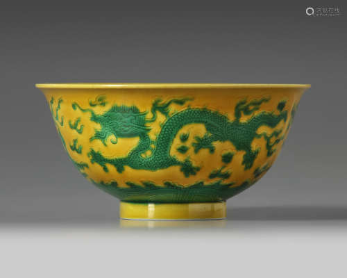 A Chinese yellow-ground green-enamelled 'dragon' bowl