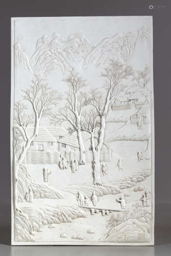A Chinese carved white biscuit landscape plaque