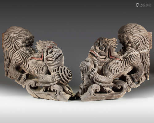 A rare set of two plain wooden corbels from Kyūshū with carved Chinese lions (karashishi)