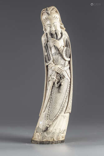 A Chinese ivory figure of Guandi
