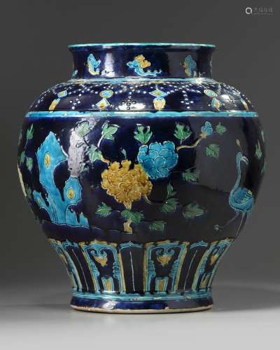 A Chinese blue-ground fahua wine jar