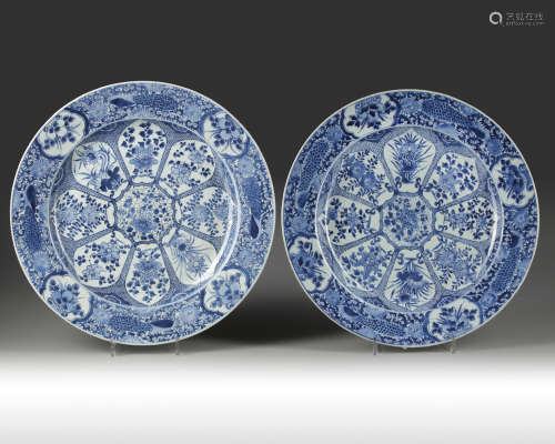 A pair of Chinese blue and white 'peacock' chargers