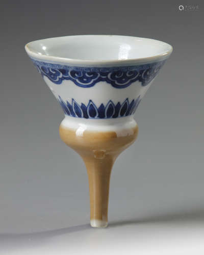 A Chinese café-au-lait glazed blue and white funnel