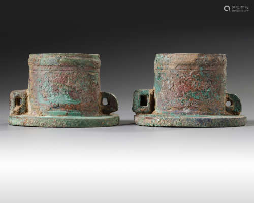 A pair of Chinese bronze axle caps