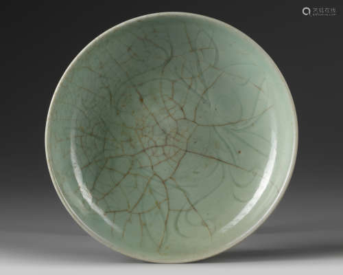 A small Chinese celadon crackle-glazed dish