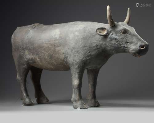 A rare Chinese painted pottery figure of an ox