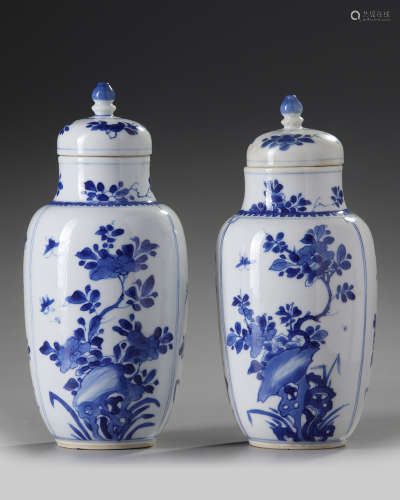 A pair of Chinese blue and white 'floral' vases and covers