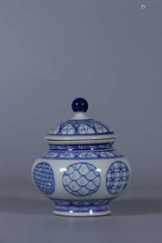 A BLUE AND WHITE JAR WITH COVER