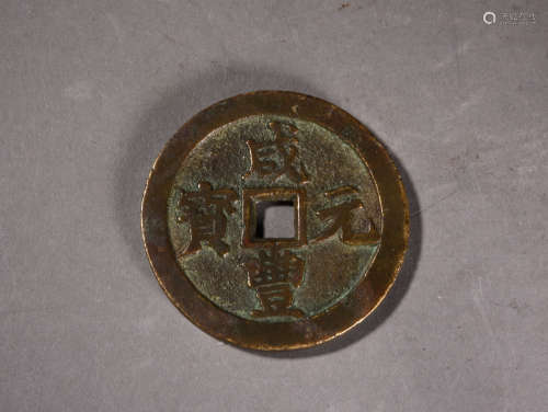 A CHINESE BRONZE COIN, 19TH CENTURY
