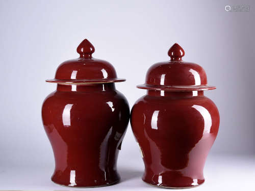 A PAIR OF RED-GLAZED JARS AND COVER, 19TH CENTURY
