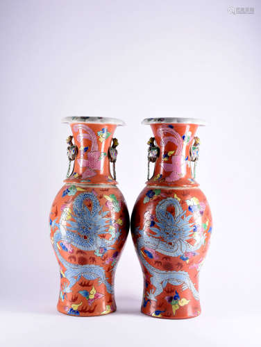 A PAIR OF CORAL-RED GROUND FAMILLE ROSE VASES, 19TH CENTURY