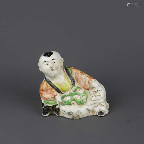 A Chinese Red and Green Glazed Porcelain Figure of Boy