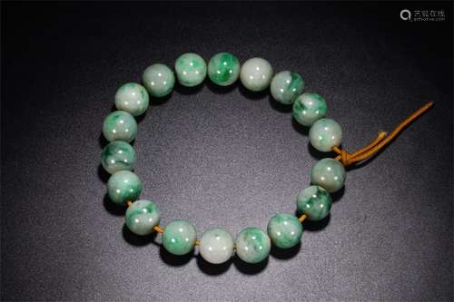 A Chinese Carved Jadeite Bracelet