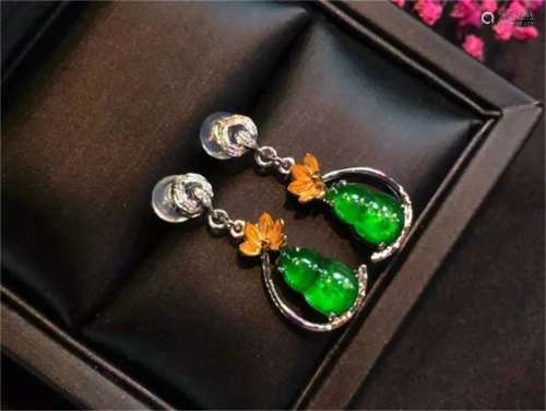 A Pair of Chinese Carved Jadeite Ear Rings