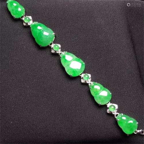 A Chinese Carved Jadeite Bracelet