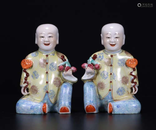 PAIR OF CHINESE PORCELAIN FAMILLE ROSE BOY STATUES