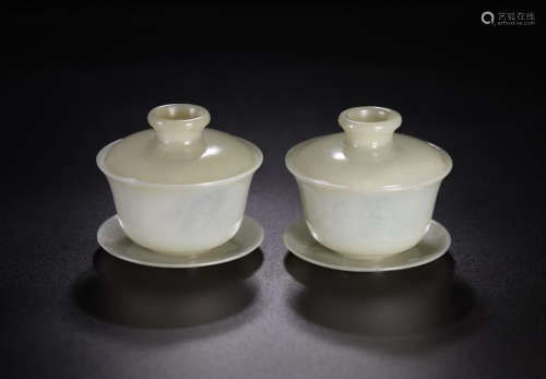 PAIR OF CHINESE GREY JADE LIDDED TEA CUPS ON DISH