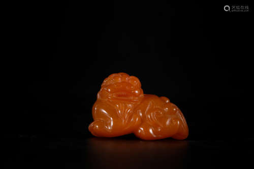 A Chinese Carved Amber Foo-Dog