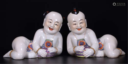 PAIR OF CHINESE PORCELAIN FAMILLE ROSE BOY TABLE ITEMS