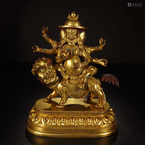 TIBETAN GILT BRONZE SIX ARM BUDDHIST GUARDIAN ON BEAST