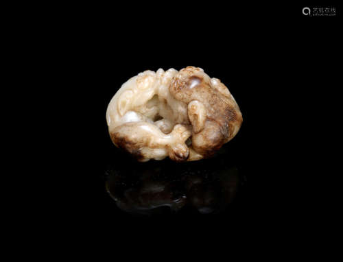 17th century or later A white and mottled brown jade 'Buddhist lion' group