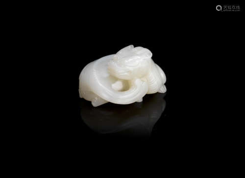 A white and russet jade 'mythical beast' carving