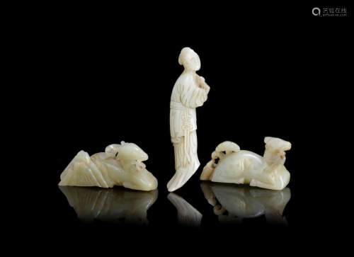 Ming Dynasty A group of three pale green jade carvings