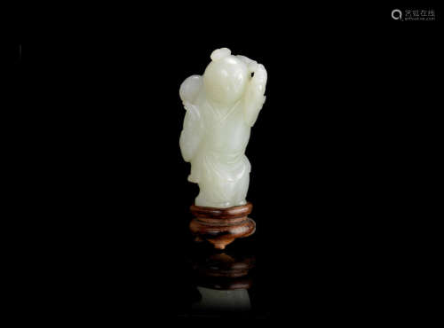 18th century A pale green jade carving of a boy
